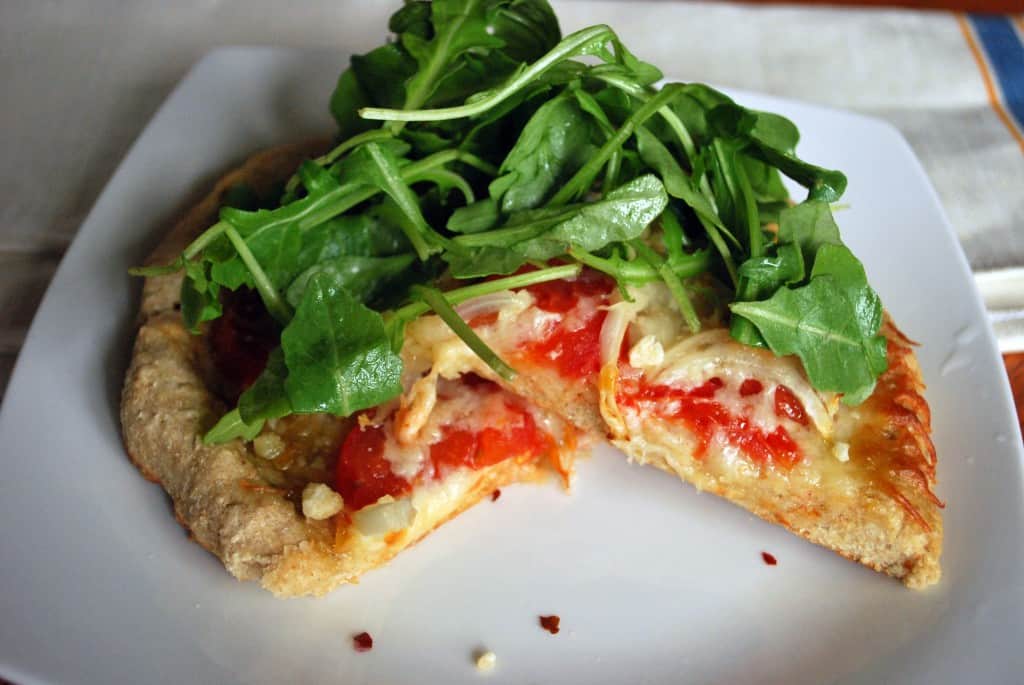 Tomato Onion and Arugala Pizza
